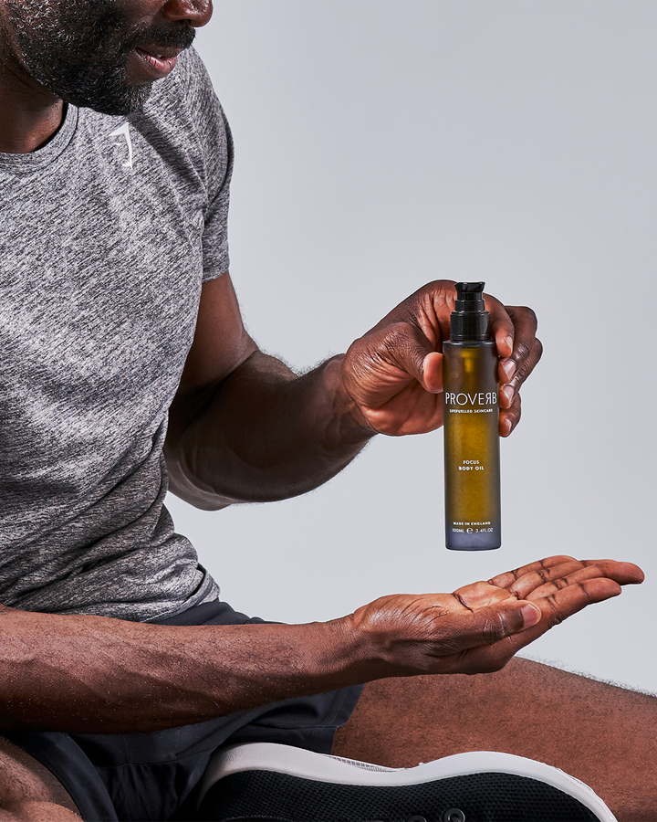 Athlete using Proverb Focus Body Oil, ideal for muscle recovery and mental clarity