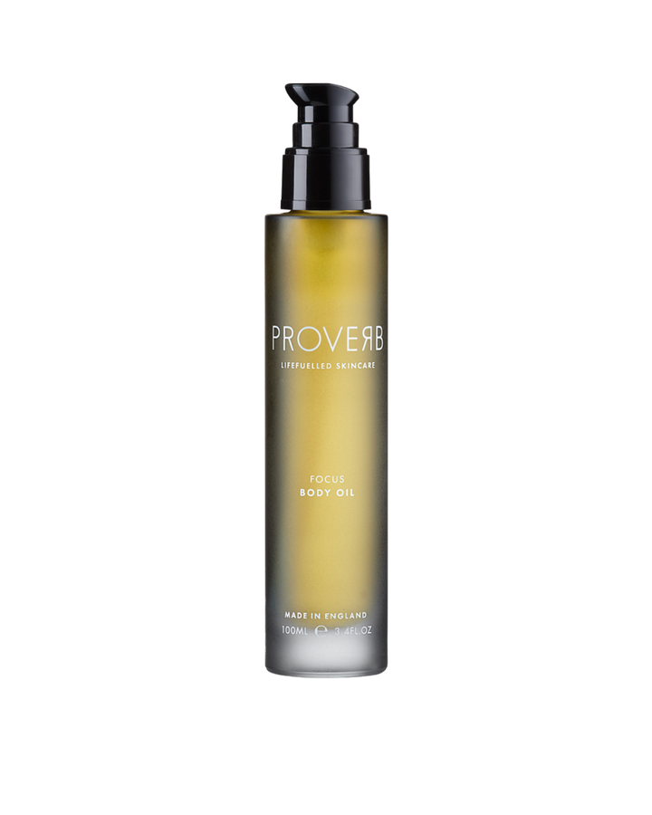Elegant Proverb Focus Body Oil bottle, showcasing premium natural skincare oil