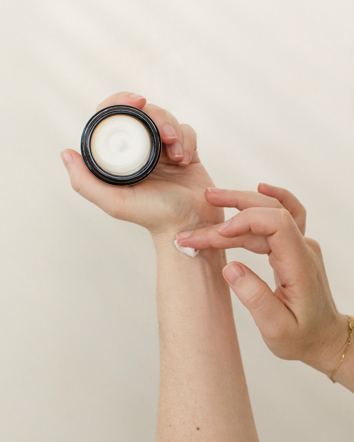 Application of Awake Organics Hands Balm, demonstrating the smooth and creamy texture for skin care
